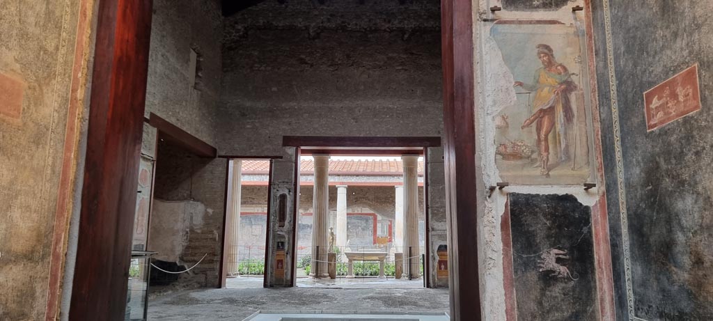 VI.15.1 Pompeii. January 2023. 
Looking west from vestibule (b) across atrium towards peristyle. Photo courtesy of Miriam Colomer.
