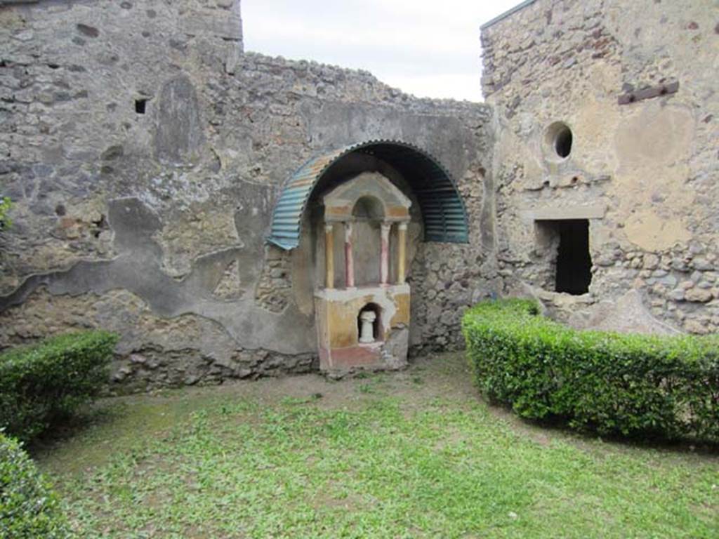 VI.15.8 Pompeii. April 2012. Looking west across garden area towards household shrine. 
Photo courtesy of Marina Fuxa.