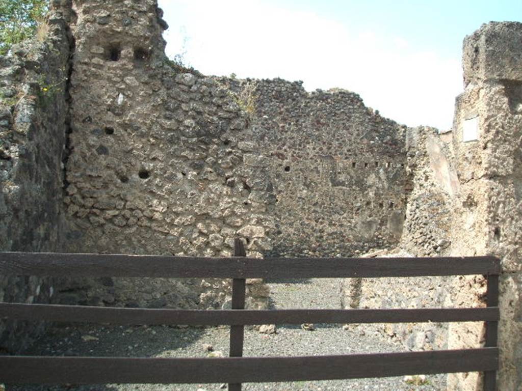VII.1.21 Pompeii. May 2005. Entrance to shop on west side of Via Stabiana.
According to Boyce, A small and crude lararium (un piccolo e rozzo larario) was reported to have been found somewhere here.
In 1937, Boyce said that there remained no indication of its nature.
Bull. Arch. Nap., N.S., i, 1853, 141.
See Boyce G. K., 1937. Corpus of the Lararia of Pompeii. Rome: MAAR 14. (p.60, no.234).