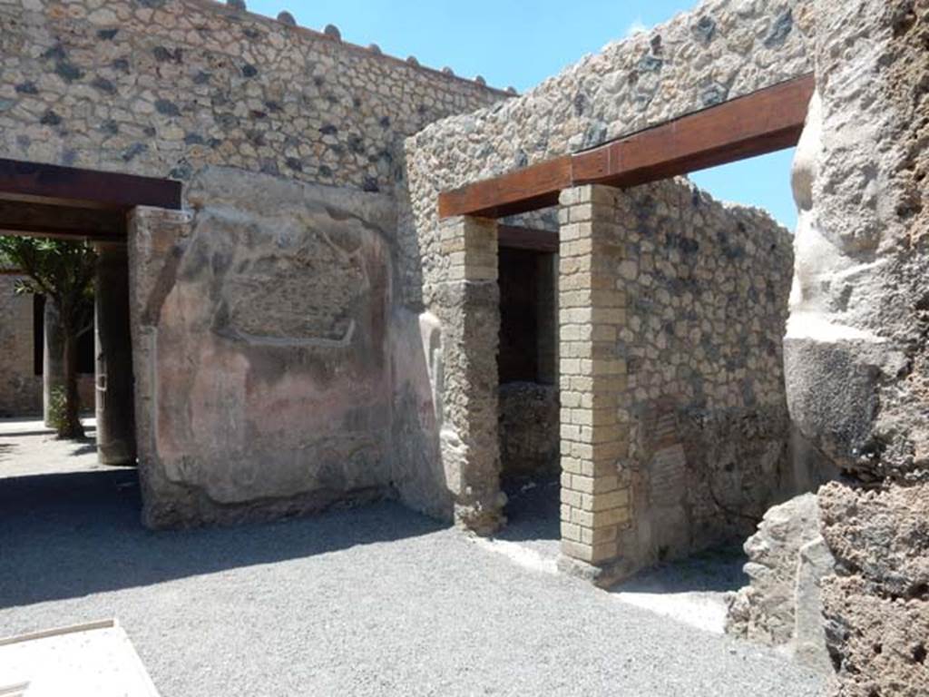 VII.1.25 Pompeii. May 2017. Looking towards north-west corner of atrium. 
On the left is the entrance to the peristyle 31, and on the right, are the doorways to rooms 28 and 27, on the north side of the atrium 24.
Photo courtesy of Buzz Ferebee.
According to Fiorelli –
On the right of the atrium, are two cubicula, and the Niche of the Penates.
(“Stanno a destra dell’atrio due cubicoli e la nicchia de’Penati.”)
See Pappalardo, U., 2001. La Descrizione di Pompei per Giuseppe Fiorelli (1875). Napoli: Massa Editore. (p.76).
According to Boyce –
In the north wall of the atrium entered at No.25 Fiorelli reports la nicchia de’Penati, where Minervini saw only a window.
See Boyce G. K., 1937. Corpus of the Lararia of Pompeii. Rome: MAAR 14. (p.60, no.237).
