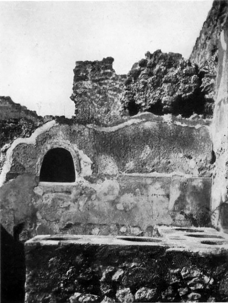 VII.1.39 Pompeii. Pre-1937. Looking across counter towards west wall with lararium niche. Photo by Tatiana Warscher.
See Boyce G. K., 1937. Corpus of the Lararia of Pompeii. Rome: MAAR 14, p. 61, no. 242, pl. 2, 3.