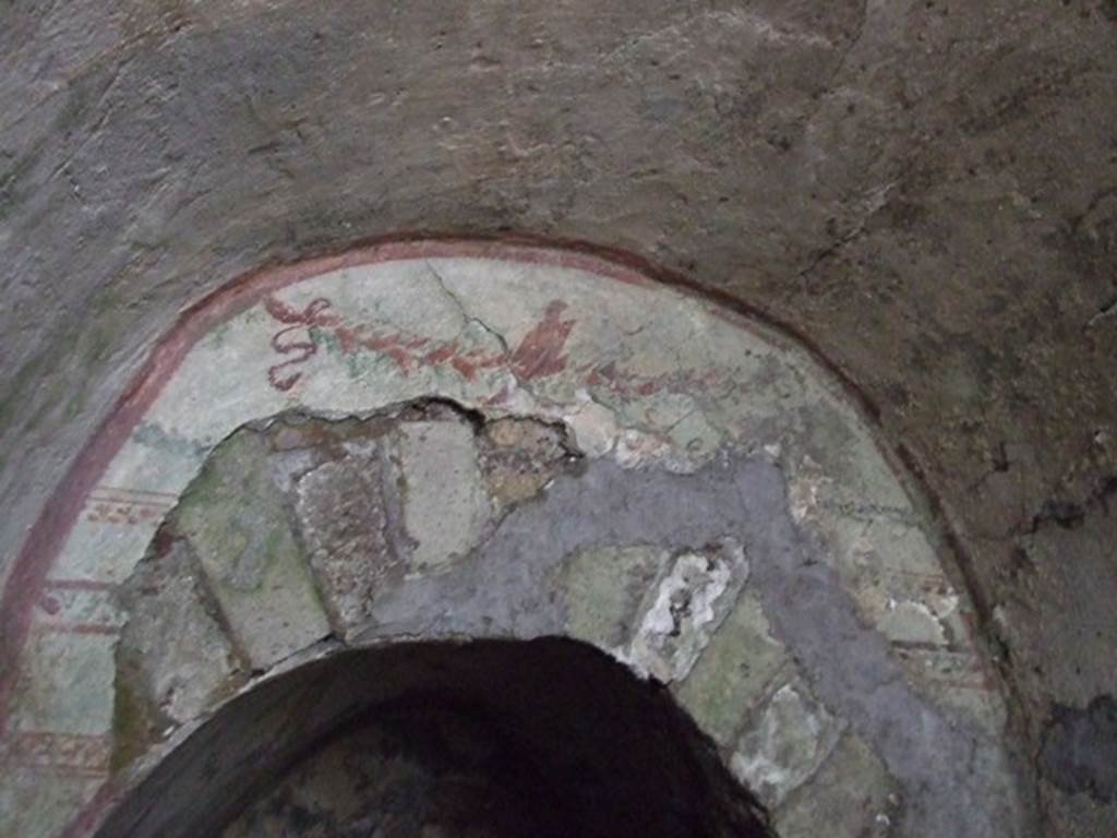 VII.2.20 Pompeii. December 2007. Painted garland above the offset doorway to the sacellum.