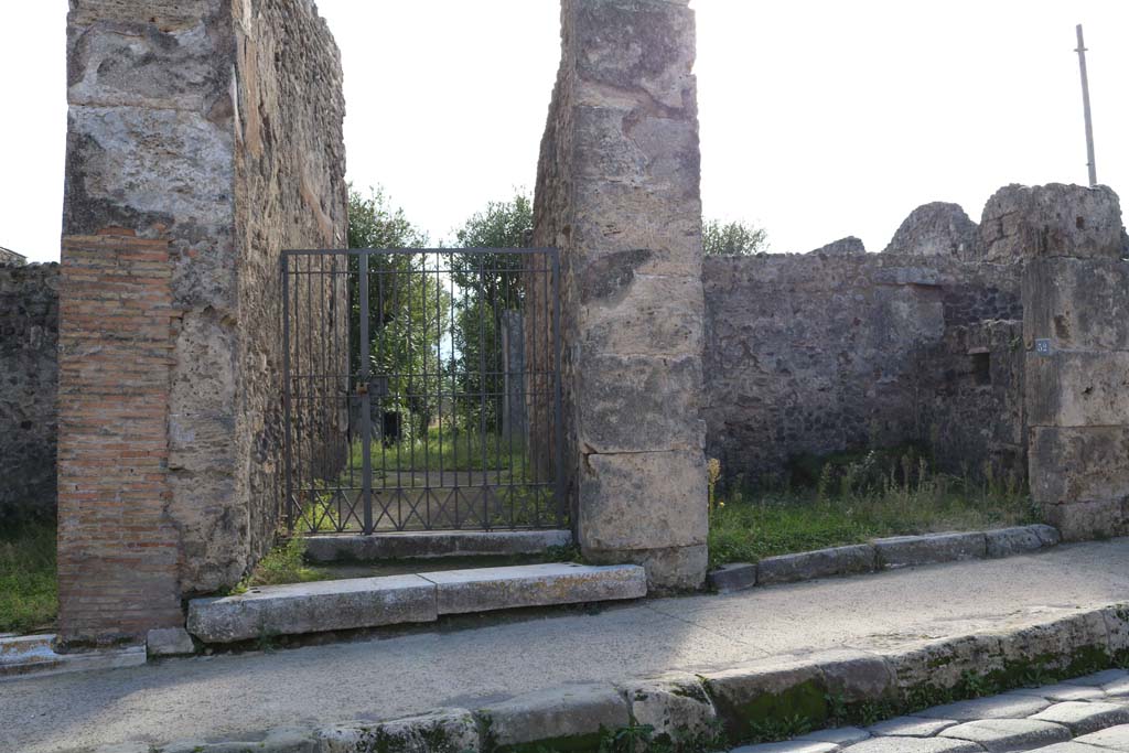 VII.4.52, Pompeii, on right. December 2018. 
Looking towards west wall of shop, on right, with square niche. Photo courtesy of Aude Durand.