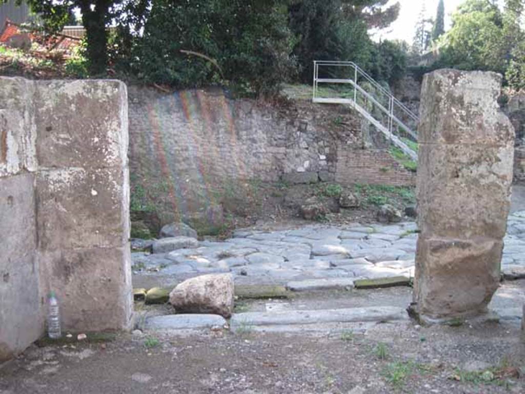 I.1.1 Pompeii. September 2010. Looking west from bar-room, across Via Stabiana. In the corner on the left would have been a staircase to the upper floor, with latrine underneath it. Photo courtesy of Drew Baker.