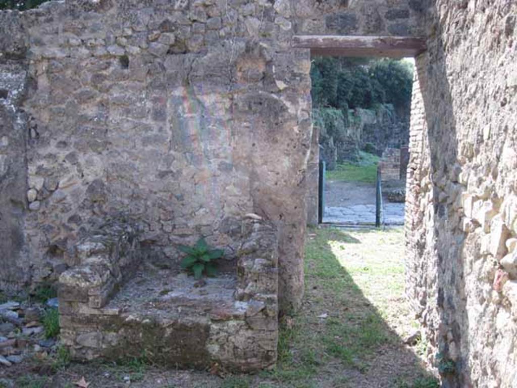I.1.2 Pompeii. September 2010. Doorway from large room, looking west into bar-room. The hearth can be seen on the south side of the doorway.
Photo courtesy of Drew Baker.