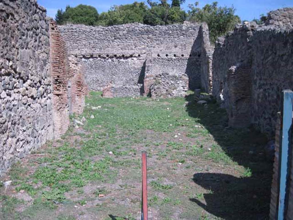 I.1.3 Pompeii. September 2010. Looking east across entrance towards yard and stables at rear. Photo courtesy of Drew Baker.