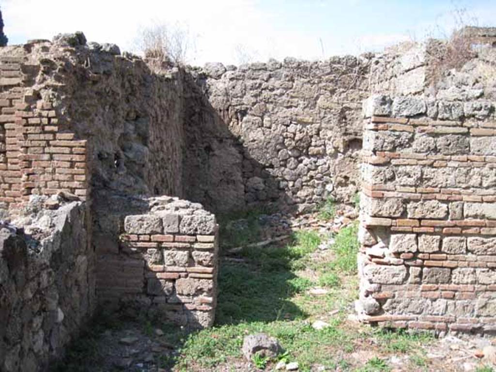 I.1.3 Pompeii. September 2010. 
Looking north through doorway of small room “e” in north-west corner of yard area. Photo courtesy of Drew Baker.