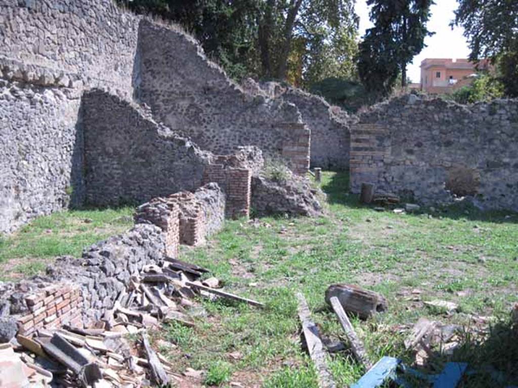 I.1.3 Pompeii. September 2010. 
Rear area of yard “c” and stables “d”, looking south to doorway to second stables area behind I.1.2. Photo courtesy of Drew Baker.