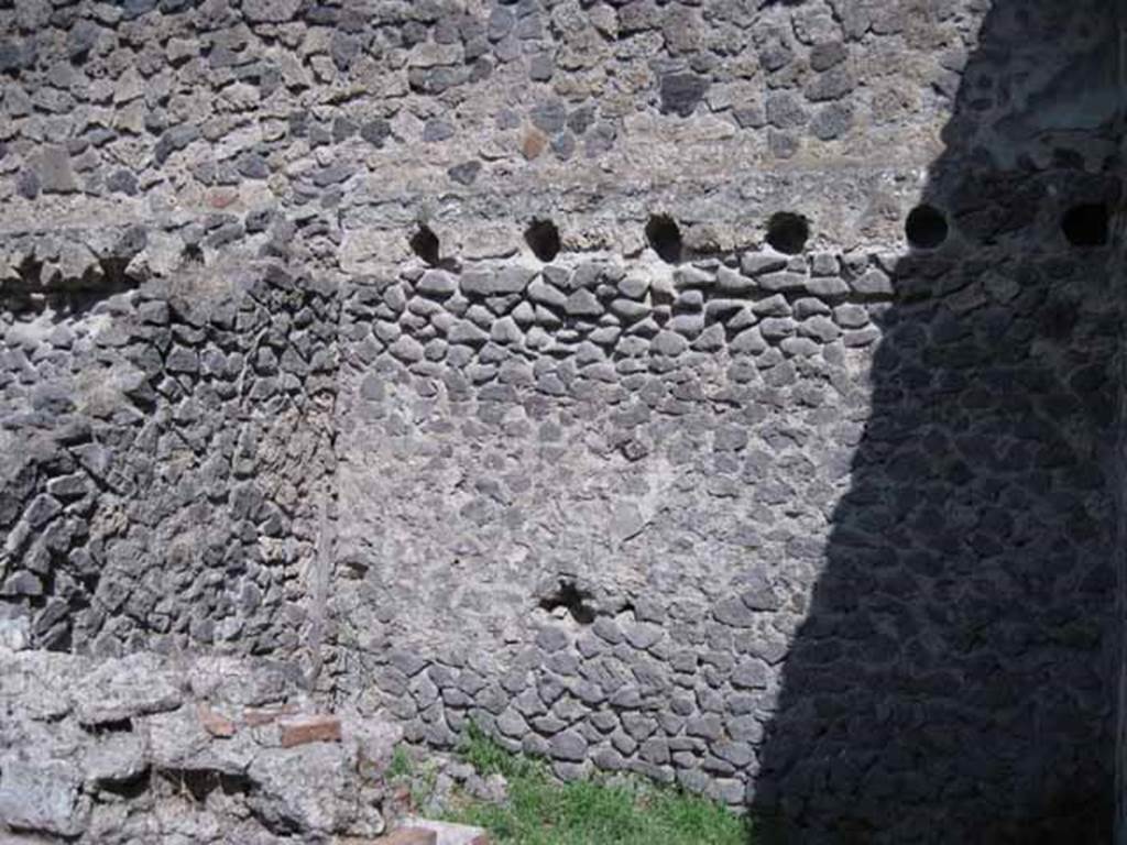 I.1.3 Pompeii. September 2010. East wall of kitchen area, with holes for supports for mezzanine floor. Photo courtesy of Drew Baker.