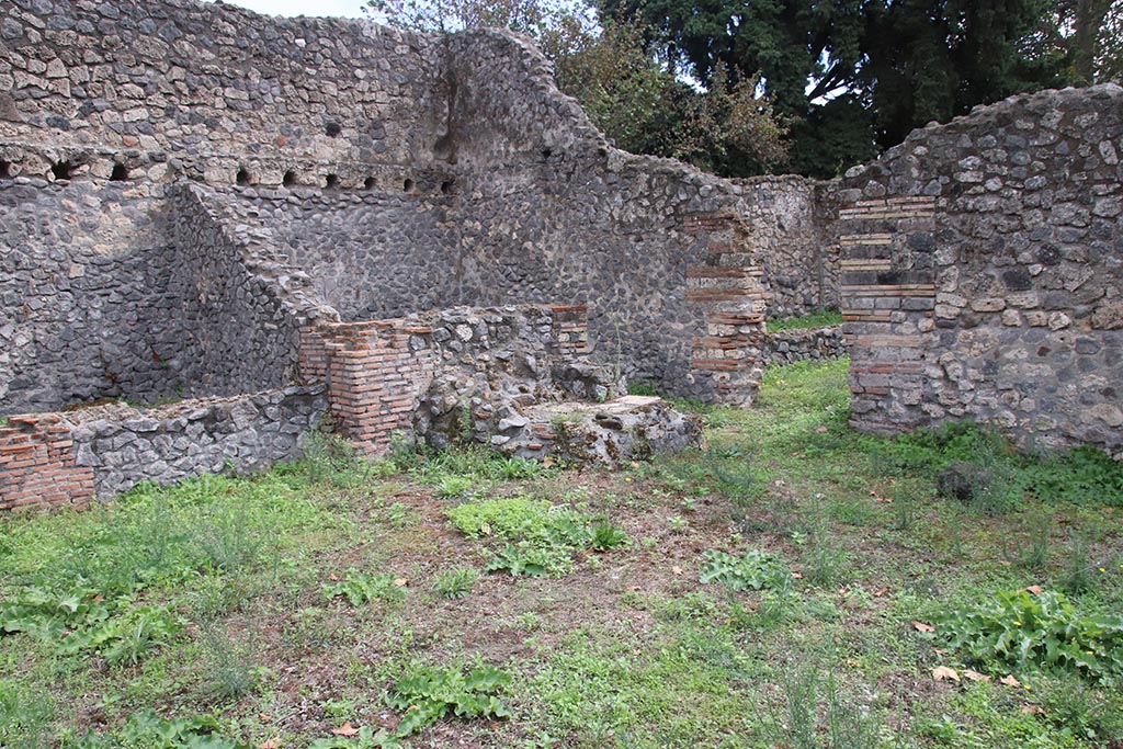 I.1.3 Pompeii, October 2024. 
Looking south-east across yard “c”, towards doorway into second stables area, “g”, on right. Photo courtesy of Klaus Heese.