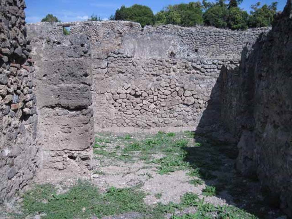 I.1.5 Pompeii. September 2010. Looking east into rear room, from shop-room.  Photo courtesy of Drew Baker.