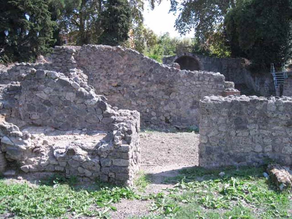 I.1.8 Pompeii. September 2010. South wall of entrance room, with doorway leading to I.1.6. Photo courtesy of Drew Baker.