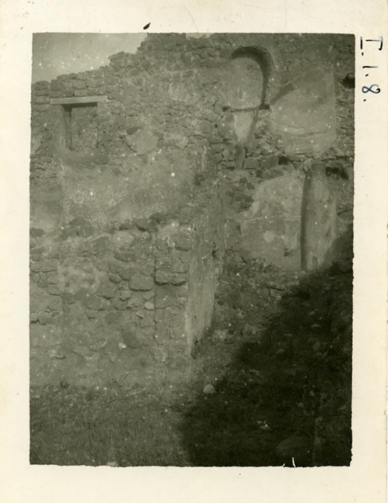 I.1.8 Pompeii. Pre-1937-39. Looking towards two rooms against the north wall.
According to Warsher –
“In the above photo, one could still see the latrine situated on the upper floor, and a brick pipe from a third latrine, which was even higher up on the wall”. The pipe can be seen on the right. 
Photo courtesy of American Academy in Rome, Photographic Archive. Warsher collection no. 001.