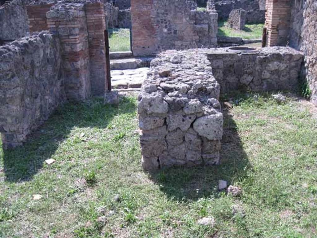 I.1.9 Pompeii. September 2010. Looking west across bar-room towards rear of counter. Photo courtesy of Drew Baker.