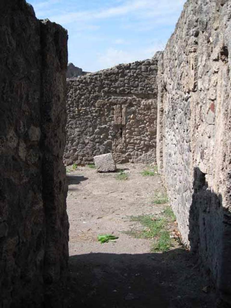 I.1.10 Pompeii. September 2010. Looking north through doorway with passage leading to I.1.1. Photo courtesy of Drew Baker.