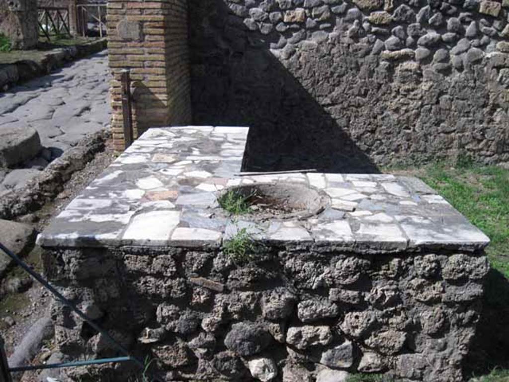 1.2.1 Pompeii. September 2010. Looking north across marble topped counter, now restored with only one dolium. Photo courtesy of Drew Baker.