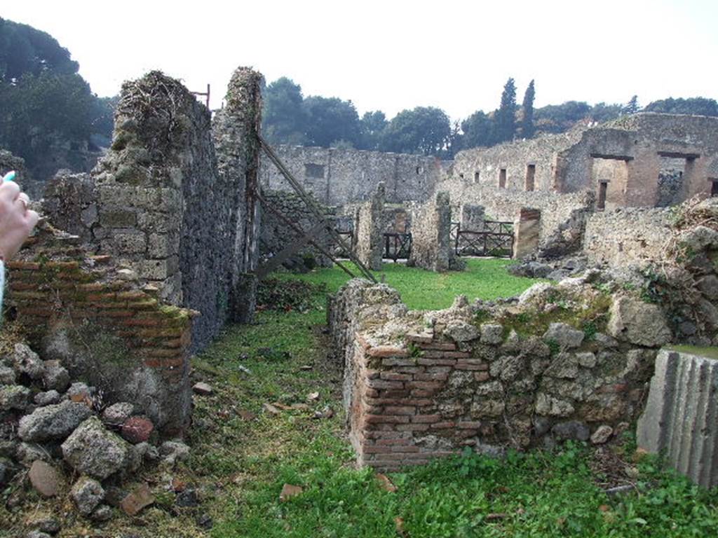 I.2.3 Pompeii. December 2006. Looking west from the garden area along corridor to atrium and entrance of house.