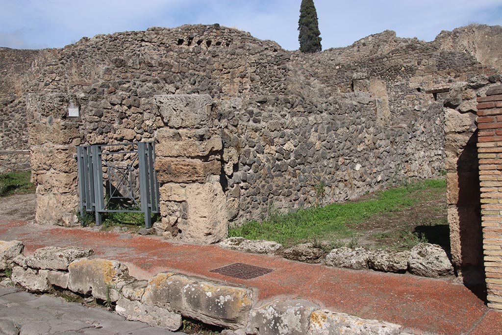 I.2.5 Pompeii, on right. October 2024. 
Looking north-east from Via Stabiana towards entrance doorway, with doorway to I.2.6, on left. Photo courtesy of Klaus Heese.