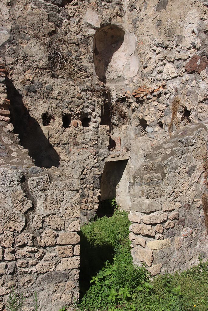 1.2.6 Pompeii. October 2024. 
Doorway to room in north-east corner of peristyle, kitchen with latrine.
Above, on the north wall of the upper floor is a niche latrine. Photo courtesy of Klaus Heese.