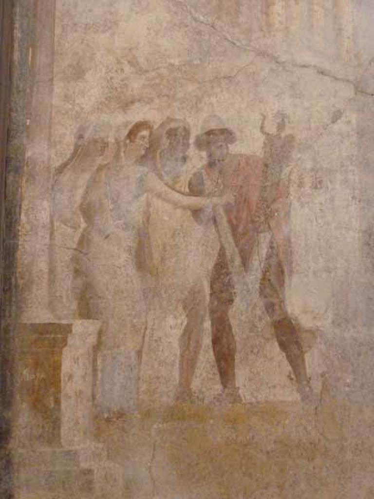 I.2.6 Pompeii.  May 2010. 
Detail from the wall painting of the Theft of the Palladium (Ratto del Palladio) found on the south wall of the triclinium. 
Now in Naples Archaeology Museum, inventory number: 109751.
Detail of a group of people on the left of the painting, Etra (Aethra), Elena (Helen) with arm outstretched and Diomede (wearing a lion skin over his head). 
Ulysses (Odysseus) is seen holding the Palladium, a statue of Athena, who would have protected the city of Troy, as long as she remained in the temple.