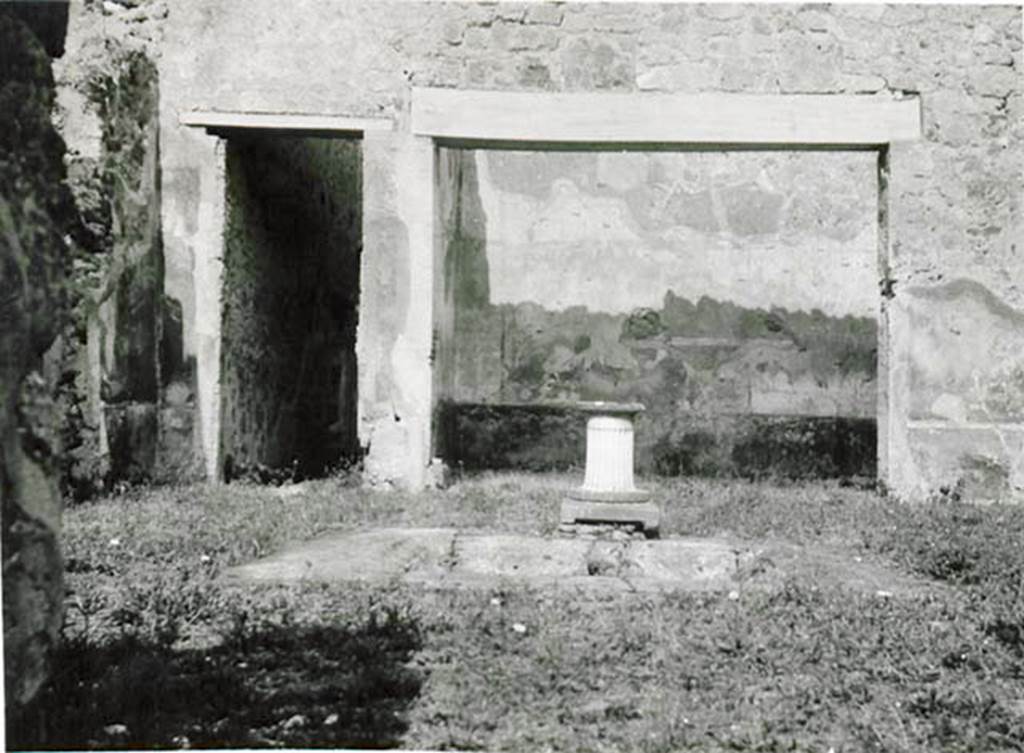 I.2.10 Pompeii. 1935 photo taken by Tatiana Warscher. Looking east across impluvium in atrium, towards doorway to corridor to rear, on left, and tablinum, on right.
See Warscher T., 1935. Codex Topographicus Pompeianus: Regio I.2. (no.21), Rome: DAIR, whose copyright it remains.