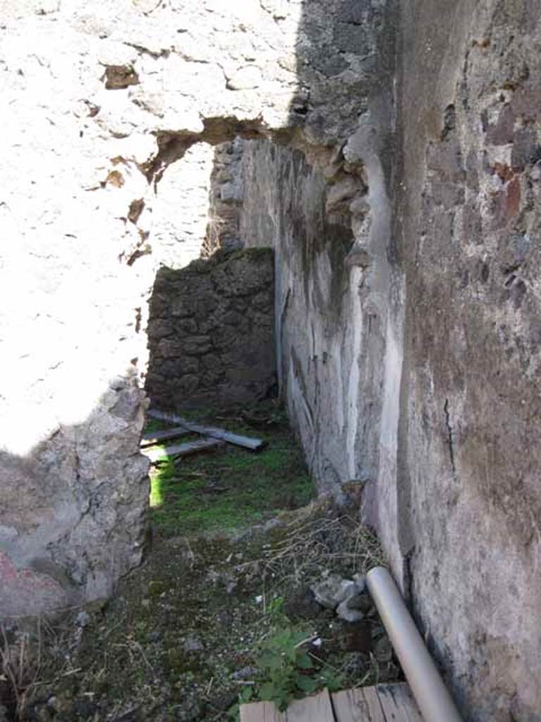 I.2.10 Pompeii. September 2010. South-east corner of tablinum, with opening into a small room (?cubiculum). Photo courtesy of Drew Baker.
According to CTP, this was recorded as an o.m.a.b (ostia murata ab antiquo = doorway blocked in antiquity) in their report.
See Van der Poel, H. B., 1986. Corpus Topographicum Pompeianum, Part IIIA. Austin: University of Texas. (p.4-5)