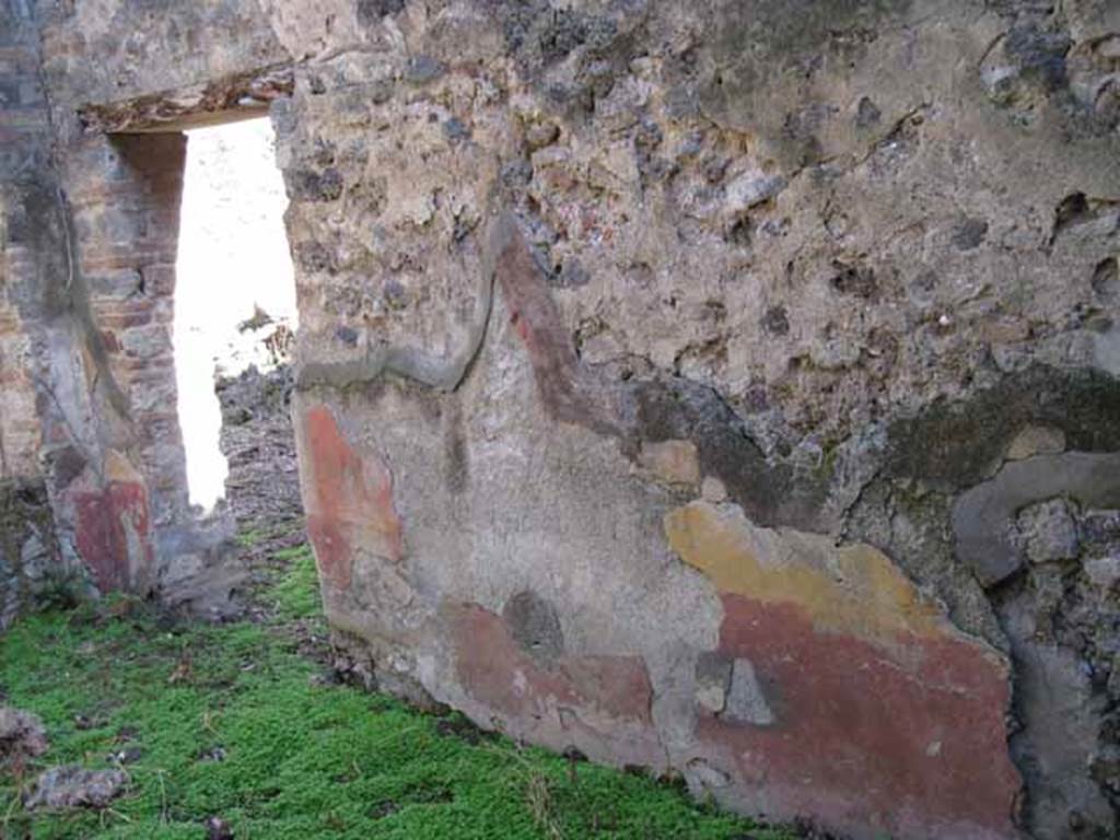 I.2.10 Pompeii. September 2010. 
South wall of triclinium, with doorway into corridor in south-east corner, on left. Photo courtesy of Drew Baker.
This wall used to show a painting of Bacchus, with cantharus and panther. 
According to Sogliano this had nearly disappeared when excavated.
See BDI ,1874, p.198.
See Sogliano, A., 1879. Le pitture murali campane scoverte negli anni 1867-79. Napoli: (p.38, no.160, described as young Dionysus).
According to Kuivalainen this was damaged when discovered and had disappeared by 1875.
It was described as Bacchus pouring wine from a cantharus to a panther”.
See Kuivalainen, I., 2021. The Portrayal of Pompeian Bacchus. Commentationes Humanarum Litterarum 140. Helsinki: Finnish Society of Sciences and Letters, (p.107, C2).