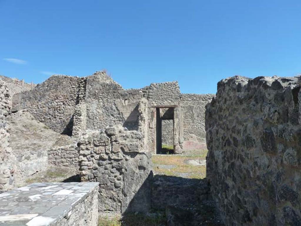 I.2.11 Pompeii. September 2015. Looking east along south wall of bar-room.