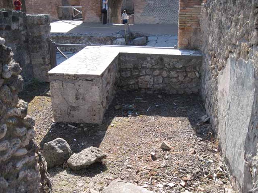 I.2.11 Pompeii. September 2010. Looking west from small room at rear of the bar towards entrance doorway. Photo courtesy of Drew Baker.