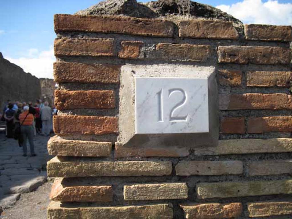 I.2.12 Pompeii. September 2010. ID number plate on north side of entrance. Photo courtesy of Drew Baker.