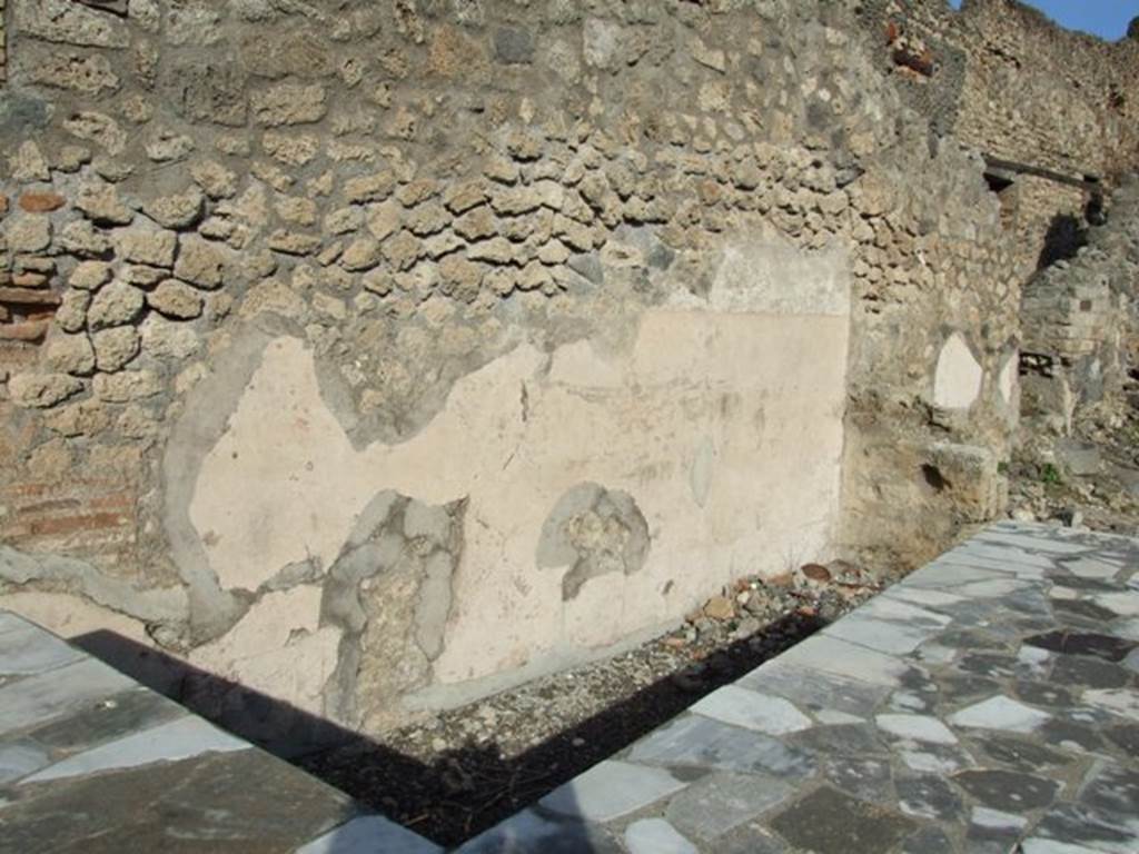I.2.13 Pompeii. December 2007. North wall and area behind serving counter.  At the far end is the entrance to I.2.14 which was an independent staircase to a dwelling above I.2.13.