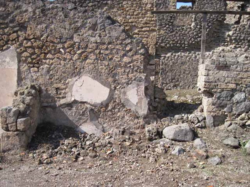 I.2.13 Pompeii. September 2010. Looking north. On the left is the site of the small room.
On the right is the doorway of I.2.14, which would have had a staircase leading up to an independent property above. Photo courtesy of Drew Baker.