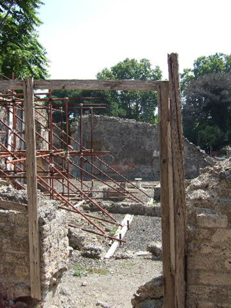 I.2.14 Pompeii. September 2005.  Entrance of independent staircase to dwelling above thermopolium at I.2.13.
Warscher described this, quoting Fiorelli, as “I.2.14, gradinata indipendente, che menava a stanze sovrapposte alle botteghe 12 e 13”.
See Warscher T., 1935. Codex Topographicus Pompeianus: Regio I.2. Rome: DAIR.
(translation: "I. 2.14, independent staircase, which led to the rooms above the shops 12 and 13.”)