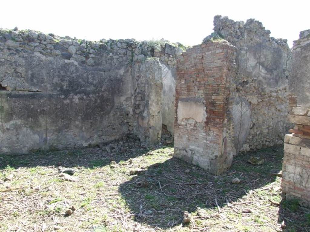 I.2.15 Pompeii. March 2009. Doorways to two rooms on west side of atrium.
According to Warscher, quoting Mau in Bull.Inst, 1873, p.240, she wrote –
“Adesso le pareti della casa in questione sono nude. Nell’anno 1873 Mau ha scritto –
“Un piccolo quadro molto distrutto si trova in una stanza a destra dell’atrio d’una casa sul lato del nord della stessa isola, la cui porta è la quarta contando dall’est.
Si distinguono due persone, delle quali quella seduta a sinistra è vestita di chitone giallo e clamide rossa. Mi pare essere un uomo. Gli sta dirimpetto un giovane che per il cappello e un bastone, che potrebbe essere un caduceo, forse deve ritenersi per Mercurio. Egli è vestito d’un chitone giallo, corto e cinto e d’una clamide che riposandogli sul braccio sinistra avvolge la parte media del corpo, lasciando libere le gambe.  Stende la mano destra verso la persona assisa”.
See Sogliano, A., 1879. Le pitture murali campane scoverte negli anni 1867-79. Napoli: Giannini. (p.37, no.152, described as “Hermes e figura indeterminata”).
See Warscher T., 1935. Codex Topographicus Pompeianus: Regio I.2. Rome: DAIR.
(translation: "Now the walls of the house in question are nude. In the year 1873 Mau wrote –  "A small very destroyed painting was located in a room to the right of the entrance hall of a house on the north side of the same insula, whose doorway was the fourth counting from the east. One can distinguish two people, the one sitting to the left was dressed in a yellow tunic and red cloak. It seemed to me to be a man.  He was facing a young man that by his hat and a cane, that may have been a caduceus, perhaps should be considered to be Mercury.  He was dressed in a short yellow tunic and girdle, and a cloak resting on his left arm that wrapped around the middle part of his body, leaving free the legs.  He was extending his right hand towards the seated person.")