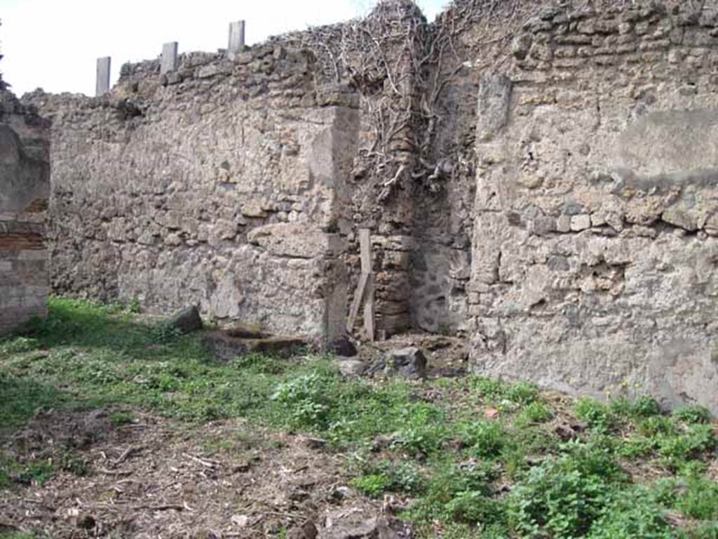 I.2.15 Pompeii. September 2010. Looking towards north wall of the atrium (north-west side) with entrance doorway in the centre. The corridor on the west side of the entrance can be seen on the left. Photo courtesy of Drew Baker.