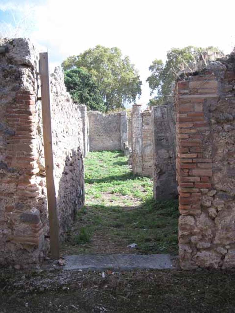 1.2.16 Pompeii. September 2010. Entrance doorway, looking south from across unnamed vicolo. Photo courtesy of Drew Baker.
According to Warscher, “I.2.16 – la casa è stata rifatta sugli avanzi di altra più antica, caduta forse per il terremoto”.
See Warscher T., 1935. Codex Topographicus Pompeianus: Regio I.2. Rome: DAIR.
(translation: I.2.16 – "the house had been repaired from the remains of another more ancient one, fallen perhaps by the earthquake”.)