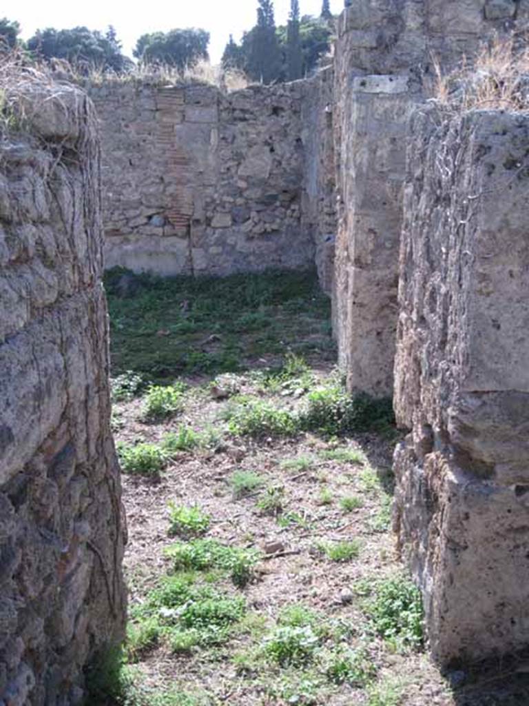 1.2.16 Pompeii. September 2010. Looking west through doorway in west wall of room 2, into north portico of room 1. Photo courtesy of Drew Baker