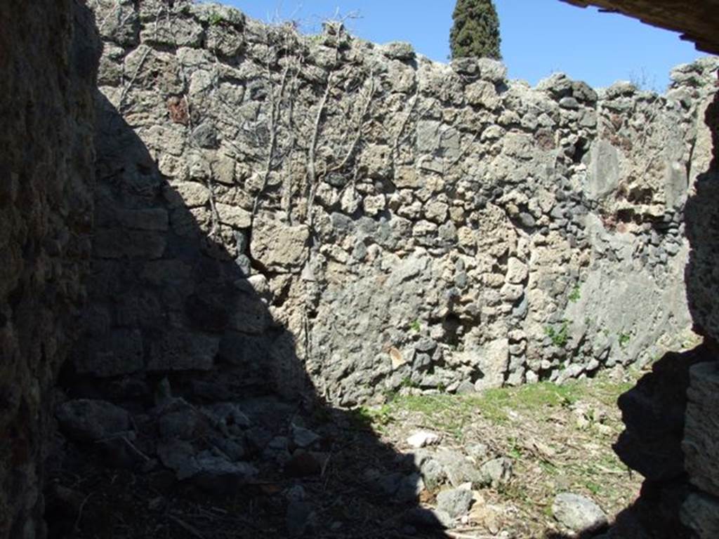 I.2.17 Pompeii. March 2009. Room 3, kitchen, with stairs to upper floor. 
Corridor to storeroom or cupboard (on left) and north wall. The dividing wall between the storeroom and kitchen is missing.