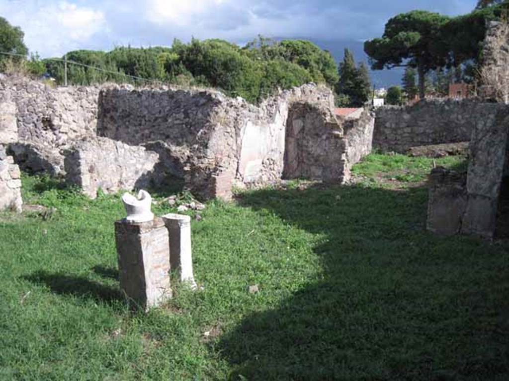 I.2.17 Pompeii. September 2010. Looking south across atrium, from near room 5.
The doorway to room 6, a cubiculum, is on the right. Photo courtesy of Drew Baker.