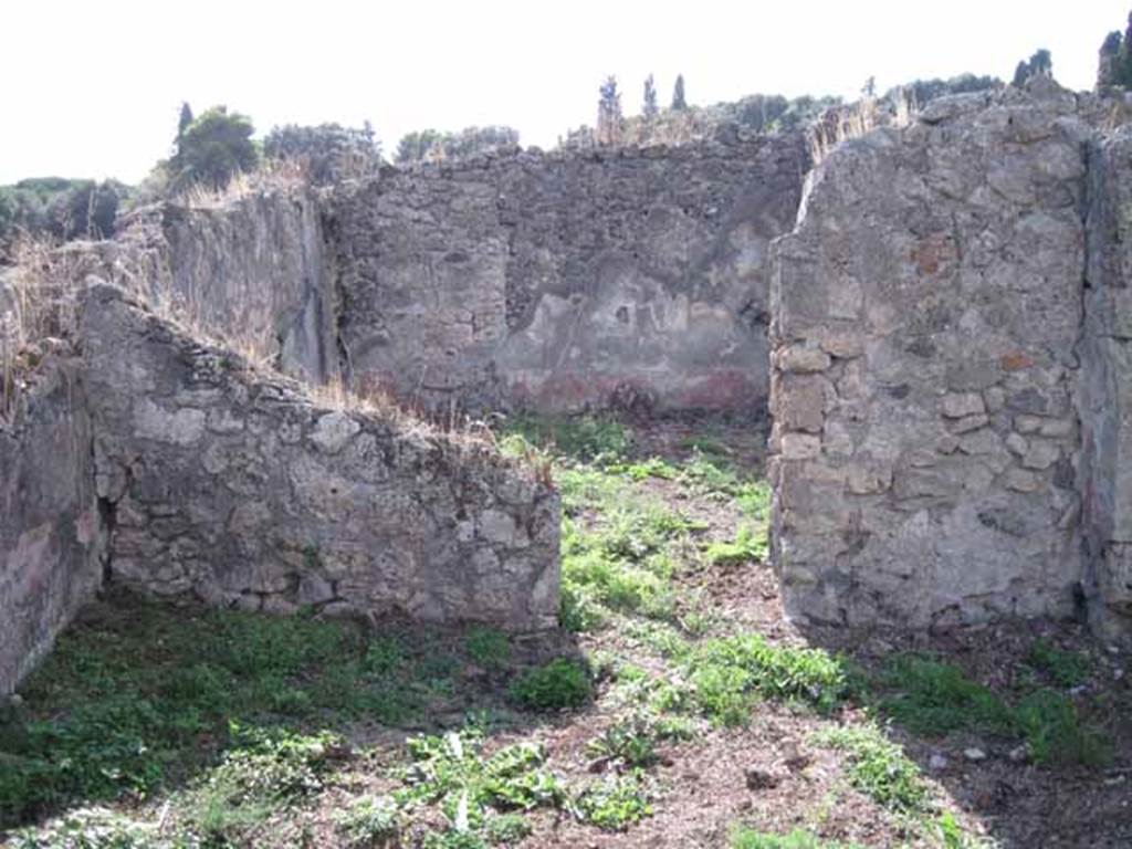 I.2.17 Pompeii. September 2010. Room 10, west wall and south-west corner with doorway into room 8, small garden area. Photo courtesy of Drew Baker.