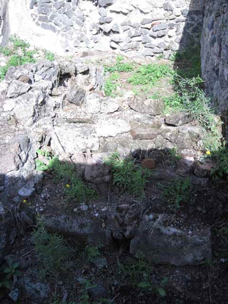 I.2.17 Pompeii. September 2010. Looking east at remains of stairs, on south side of doorway to room 11. Photo courtesy of Drew Baker.
