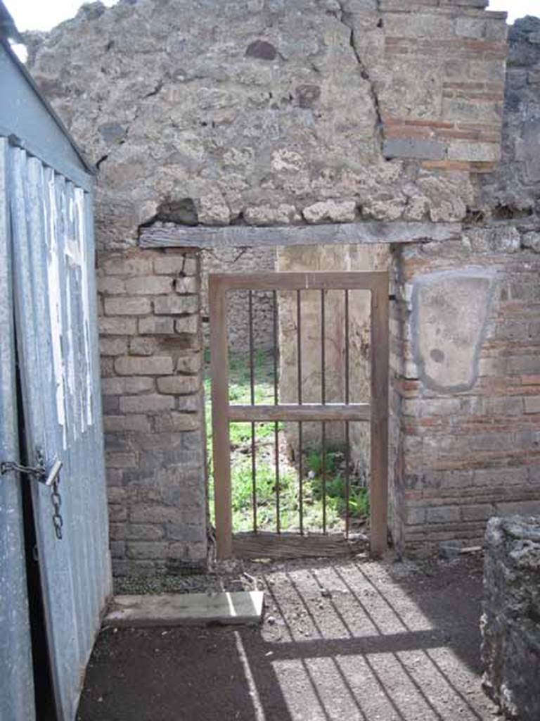 I.2.18 Pompeii. September 2010. Looking west from rear of bar counter, towards doorway to peristyle garden of I.2.17. Photo courtesy of Drew Baker.