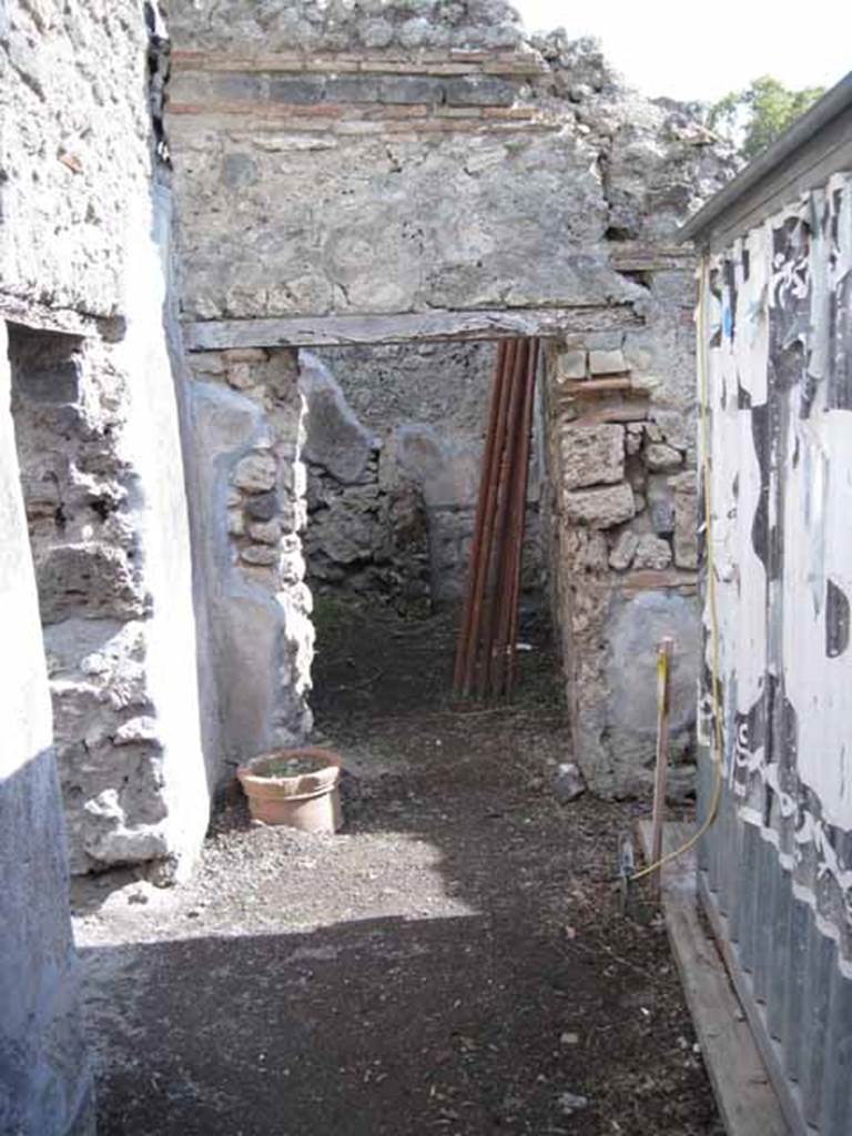 .2.18 Pompeii. September 2010.  Looking south from rear of bar, towards doorway of I.2.19 (on left) and doorway to room in south-east corner.
Photo courtesy of Drew Baker.