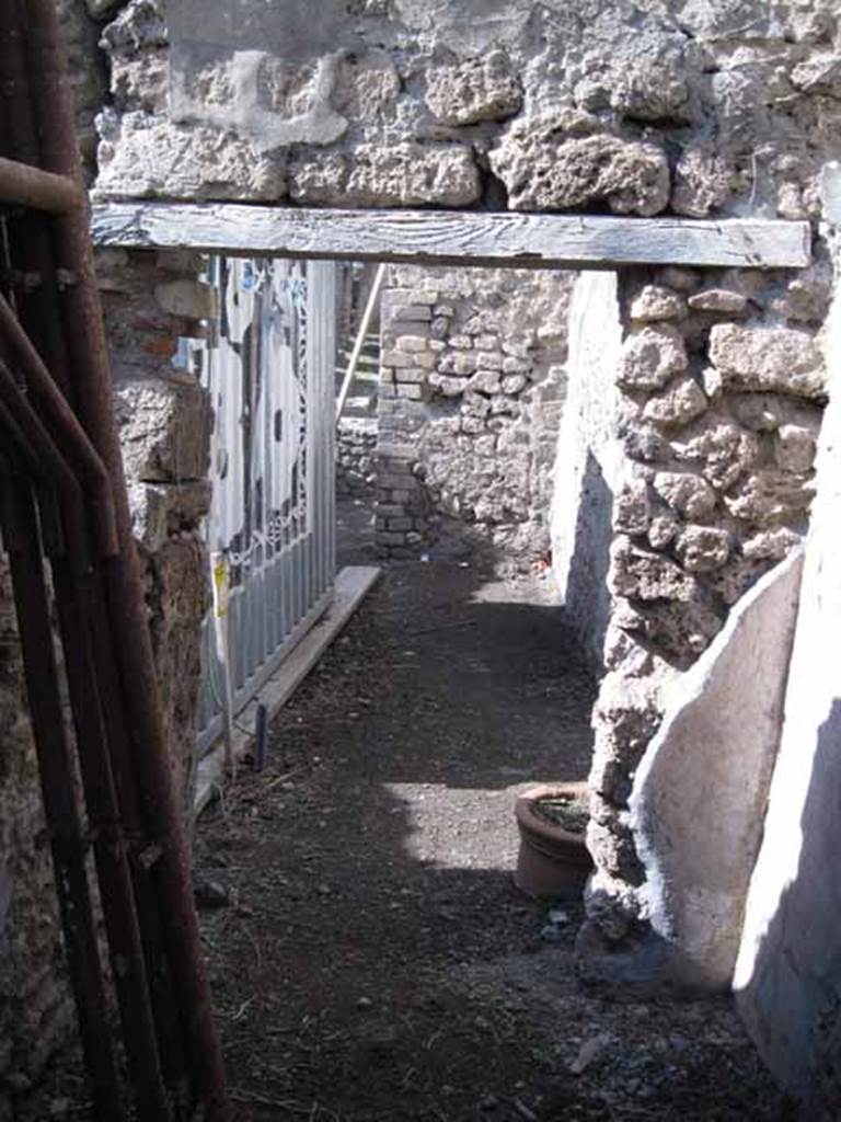 I.2.18 Pompeii. September 2010. Looking north from small room towards front of bar. Photo courtesy of Drew Baker.