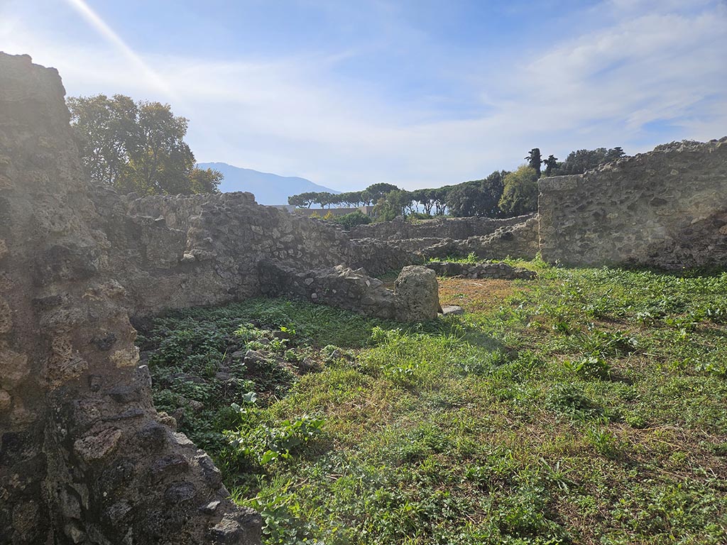 I.2.20 Pompeii. November 2024. 
Looking south-west from small atrium towards rooms on south side of garden area. Photo courtesy of Annette Haug.