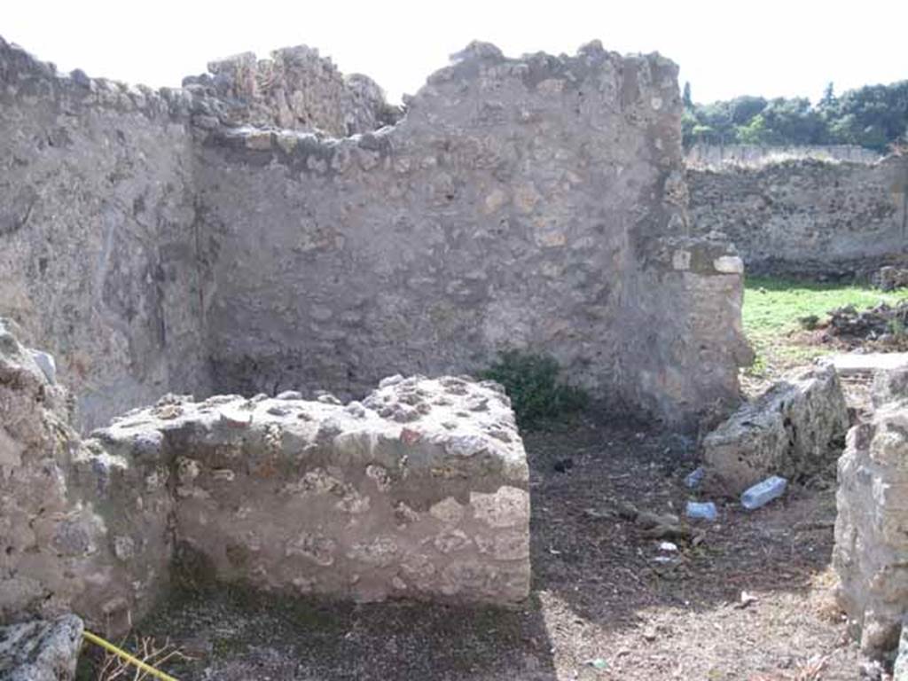 I.2.21 Pompeii. September 2010. Looking west towards entrance doorway across vicolo.
Photo courtesy of Drew Baker. According to Warscher, quoting Fiorelli, she described –
“Il thermopolium no.21 aveva una sola taberna, col banco rivestito di marmi, ed un separato focolare, a destra della porta”.  (translation: “The thermopolium no.21, had only one room, with bench faced with marble, and a separate hearth, to the right of the door”.)
See Fiorelli, Descrizione, p.45/46.
See Pappalardo, U., 2001. La Descrizione di Pompei per Giuseppe Fiorelli (1875). Napoli: Massa Editore, (p.36).
See Warscher T., 1935. Codex Topographicus Pompeianus: Regio I.2. Rome: DAIR, whose copyright it remains.
