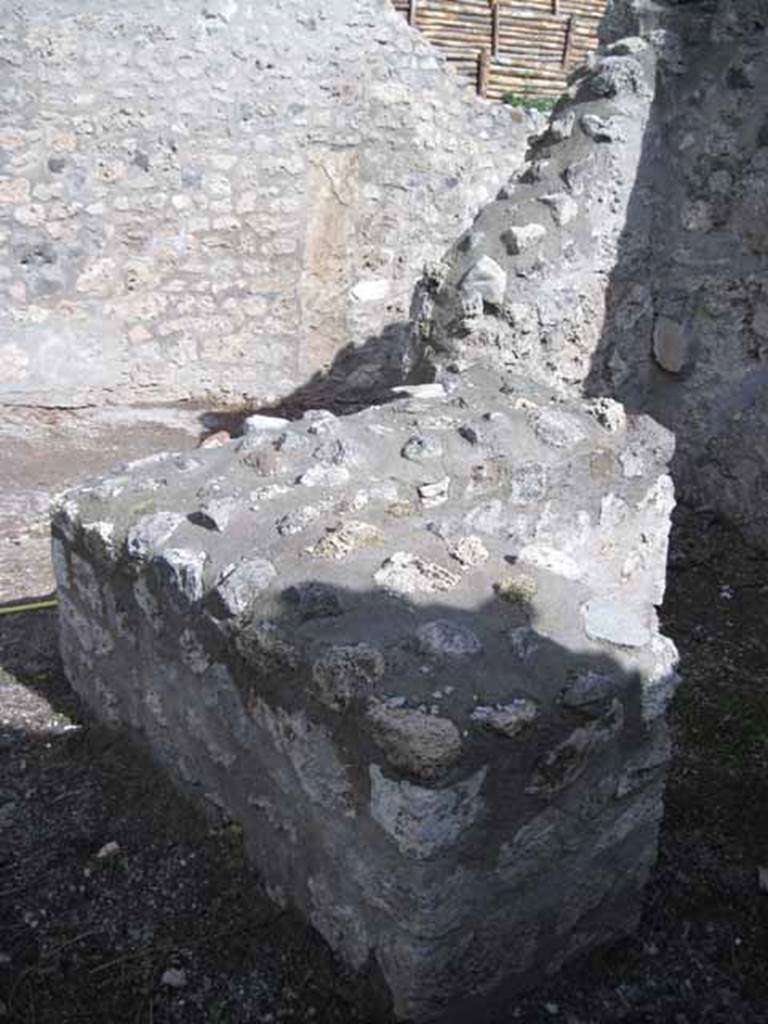 I.2.21 Pompeii. September 2010. Looking east across bar-counter towards Vicolo del Citarista. Photo courtesy of Drew Baker.