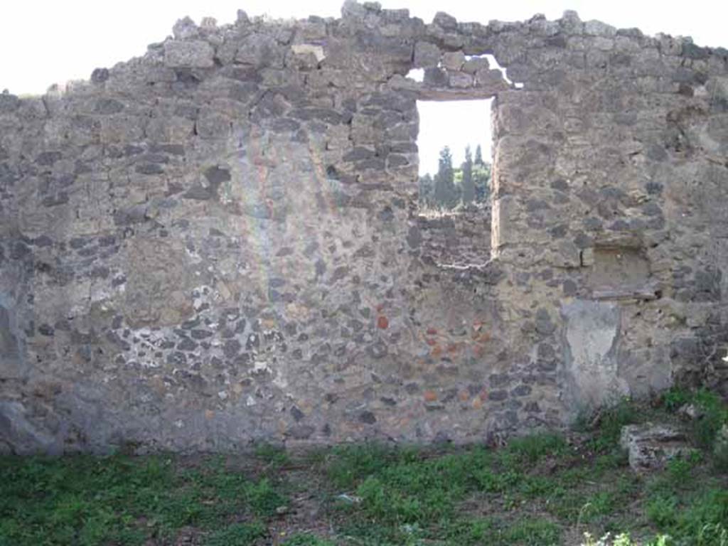 I.2.22 Pompeii. September 2010. Room 5, west wall of garden area, with window overlooking I.2.24. Photo courtesy of Drew Baker.