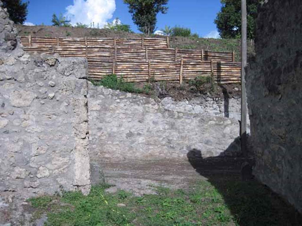 I.2.22 Pompeii. September 2010. Looking east from shop-room, out of doorway onto Vicolo del Citarista. Photo courtesy of Drew Baker.