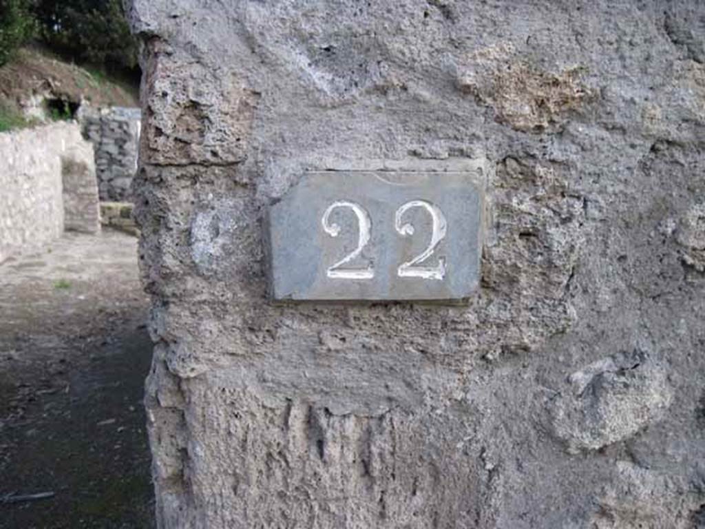 I.2.22 Pompeii. September 2010. ID number plate on south side of doorway. Looking south. Photo courtesy of Drew Baker.